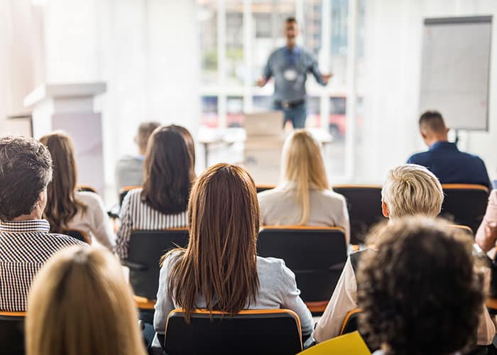 franchise owners learning about travel franchise fees 