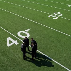 Businessmen on Sports Field
