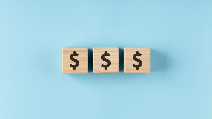 wooden block dollar signs 