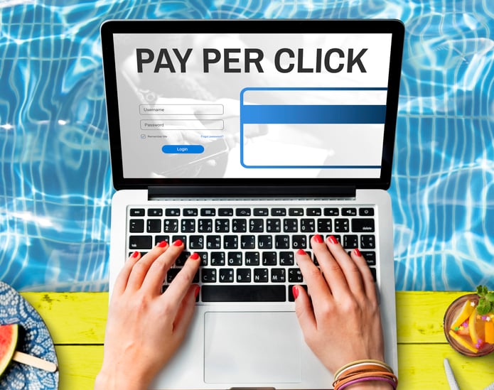 the words pay per click on a laptop screen