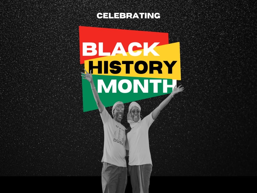 Black History Month words with two people celebrating