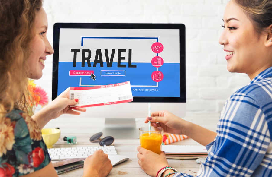 Travel agent handing a booking to a client 