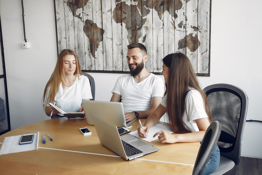 young team of travel agents working together